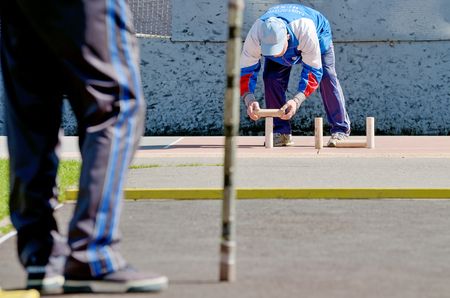 Saint-Petersburg.Russia.may.09.2017.Gorodki - a Russian folk sports game. In this game you need specific distances to smash figures made in different ways from five wooden cylinders.のeditorial素材