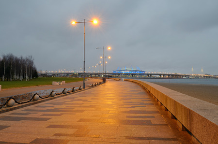 Embankment paved with stone.At night it is illuminated by electric light.の写真素材