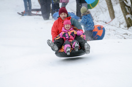 Saint-Petersburg.Russia.January.21.2018.Ride in winter from the mountains in tubing.They're inflatable cameras.They quickly glide on snow.のeditorial素材