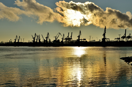 The seaport is working on loading ships.The round the clock work.の写真素材