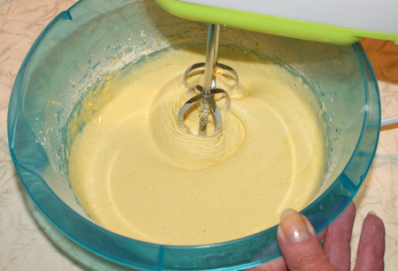 The dough for the pie with apples.Confectionery mixture is whipped with an electric mixer.の写真素材
