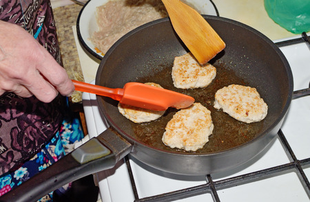 In a frying pan fry the Turkey cutlets.Delicious, meat dish.の写真素材
