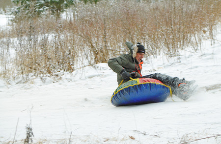 Saint-Petersburg.Russia.December.23.2018.Ride in winter from the mountains in tubing.They're inflatable cameras.They quickly glide on snow.のeditorial素材