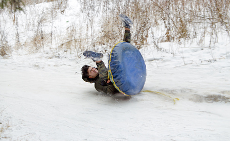 Saint-Petersburg.Russia.December.23.2018.Ride in winter from the mountains in tubing.They're inflatable cameras.They quickly glide on snow.のeditorial素材