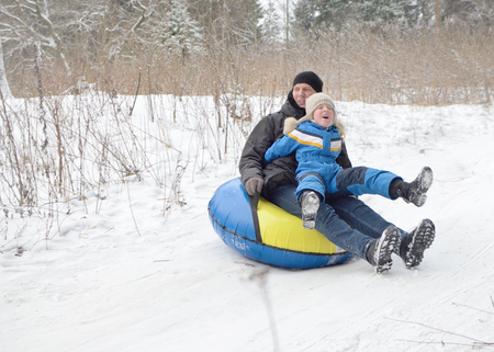 Saint-Petersburg.Russia.December.23.2018.Ride in winter from the mountains in tubing.They're inflatable cameras.They quickly glide on snow.のeditorial素材