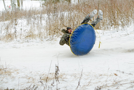 Saint-Petersburg.Russia.December.23.2018.Ride in winter from the mountains in tubing.They're inflatable cameras.They quickly glide on snow.のeditorial素材