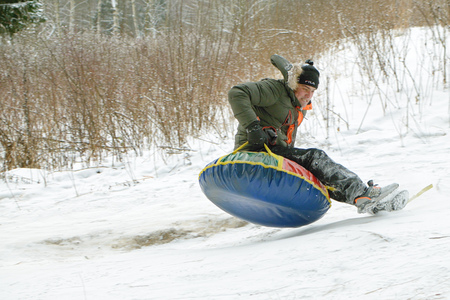 Saint-Petersburg.Russia.December.23.2018.Ride in winter from the mountains in tubing.They're inflatable cameras.They quickly glide on snow.のeditorial素材