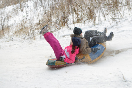 Saint-Petersburg.Russia.December.23.2018.Ride in winter from the mountains in tubing.They're inflatable cameras.They quickly glide on snow.のeditorial素材