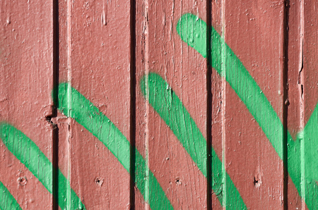 Wooden boards on the door.Painted in yellow.The old paint crumbles.の写真素材