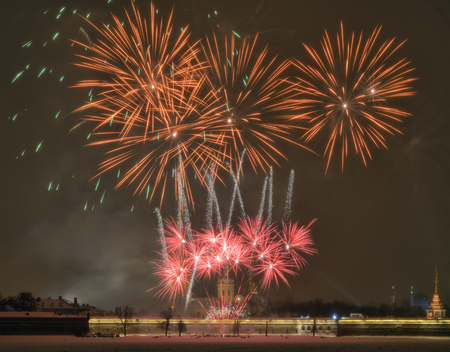 Beautiful festive fireworks for Christmas.Bright fireworks over the Peter and Paul fortress.の写真素材