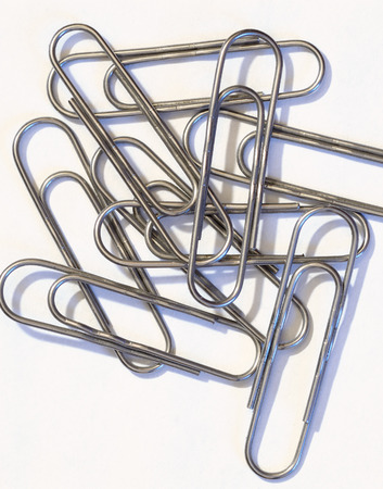 The paper clip is used to fasten paper sheets.It's a stationery tool.の写真素材