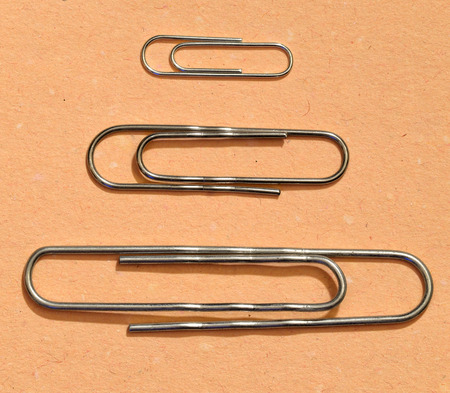 The paper clip is used to fasten paper sheets.It's a stationery tool.の写真素材