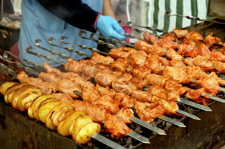 Cooking meat dishes.shashlik is prepared on coals.の写真素材