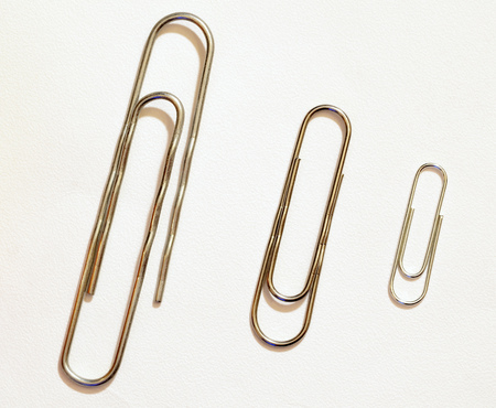 The paper clip is used to fasten paper sheets.It's a stationery tool.の写真素材