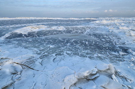 The Bay is covered with ice.Frost had formed from the snow a beautiful texture.の写真素材