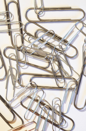 The paper clip is used to fasten paper sheets.It's a stationery tool.の写真素材