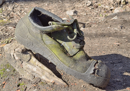 Discarded old torn shoes.It must be disposed of.の写真素材