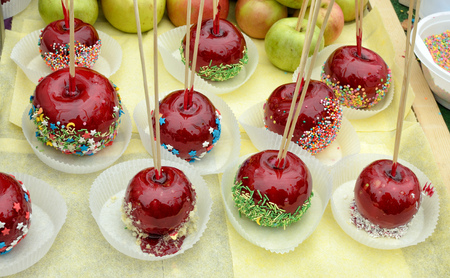Apples in a sugary glaze on the table.This is a delicious treat for children.の写真素材