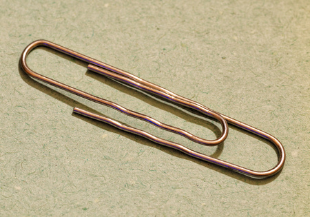 The paper clip is used to fasten paper sheets.It's a stationery tool.の写真素材