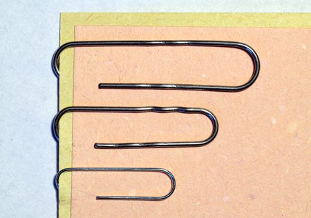 The paper clip is used to fasten paper sheets.It's a stationery tool.の写真素材