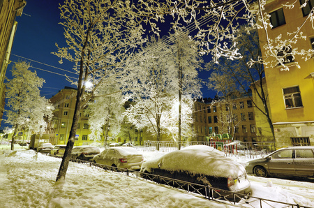 Night city in winter.It's freezing outside.There is a lot of snow around.の写真素材