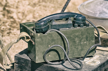 On the table lies a typewriter and a telephone for communication.の写真素材