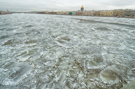 The river is covered with ice.Frost formed a beautiful texture of snow.の写真素材