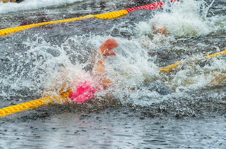 Lovers of winter swimming.Swimmer swims in the pool.He swims the distance at speed.の写真素材