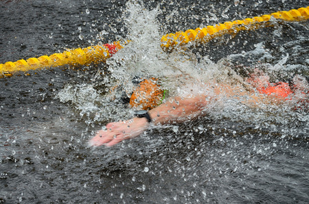 Lovers of winter swimming.Swimmer swims in the pool.He swims the distance at speed.の写真素材