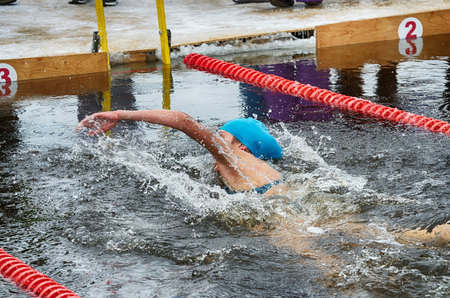 Lovers of winter swimming.Swimmer swims in the pool.He swims the distance at speed.の写真素材