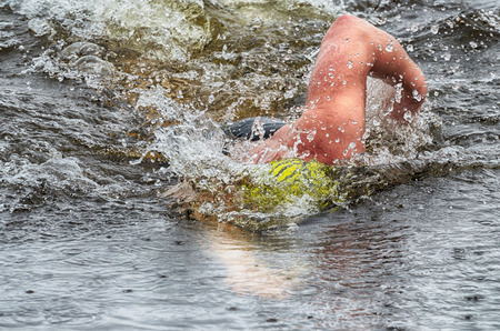 Lovers of winter swimming.Swimmer swims in the pool.He swims the distance at speed.の写真素材