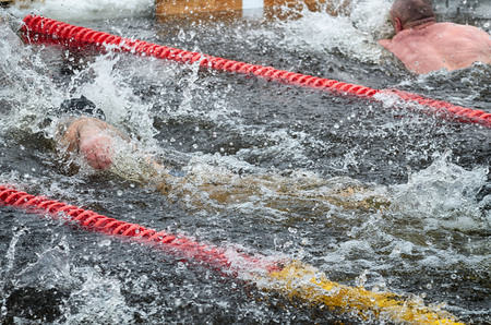 Lovers of winter swimming.Swimmer swims in the pool.He swims the distance at speed.の写真素材