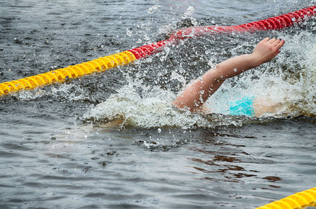 Lovers of winter swimming.Swimmer swims in the pool.He swims the distance at speed.