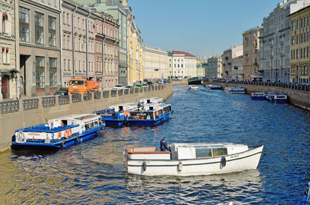 Saint-Petersburg.Russia.April.21.2019.Tourist ships floating on the rivers and canals of the city.They carry city tours.のeditorial素材