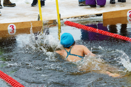 Lovers of winter swimming.Swimmer swims in the pool.He swims the distance at speed.の写真素材