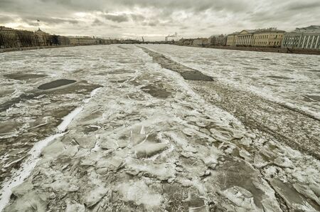 The river is covered with ice.Frost formed a beautiful texture of snow.の写真素材