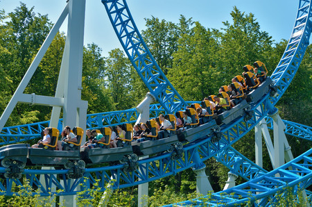 Saint-Petersburg.Russia. July.15.2018. Kresovsky island.Divo island Park.A popular attraction is the Russian roller coaster.It is a railway system of special design.Passengers traveling in railcar at high speed.のeditorial素材
