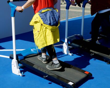 Athlete trains on a simulator.Running with adjustable muscle load.