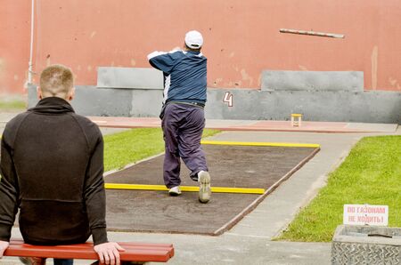 Gorodki - a Russian folk sports game. In this game you need specific distances to smash figures made in different ways from five wooden cylinders.の写真素材
