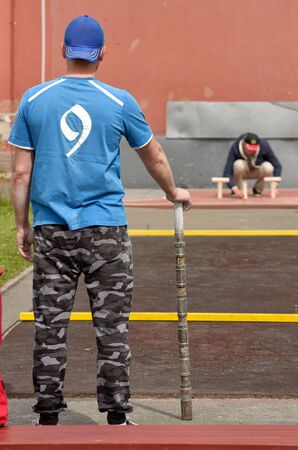 Gorodki - a Russian folk sports game. In this game you need specific distances to smash figures made in different ways from five wooden cylinders.の写真素材