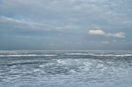 It's a cold and frosty winter.The Bay is covered with ice.の写真素材