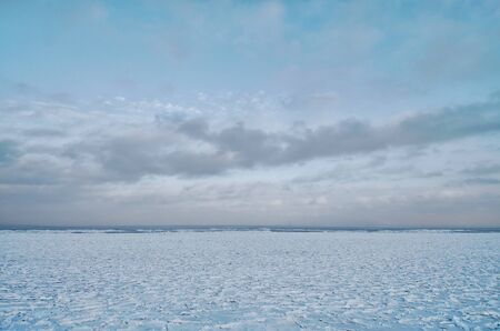 It's a cold and frosty winter.The Bay is covered with ice.の写真素材