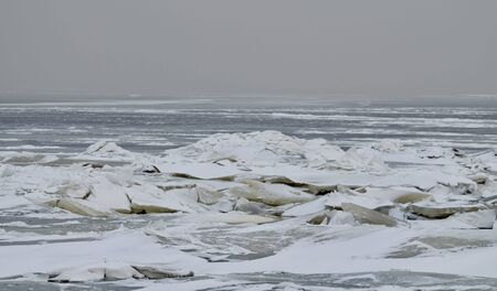 It's a cold and frosty winter.The Bay is covered with ice.の写真素材
