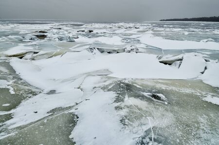 It's a cold and frosty winter.The Bay is covered with ice.の写真素材