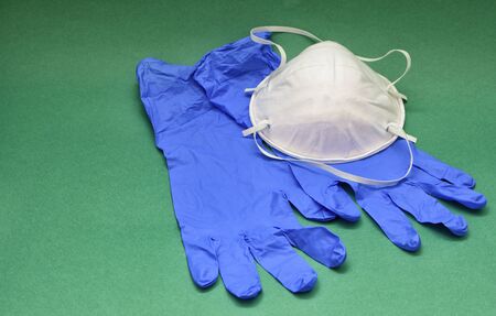 Remedies for coronavirus Covid-19.This is a mask on the face and gloves on the hands.の写真素材