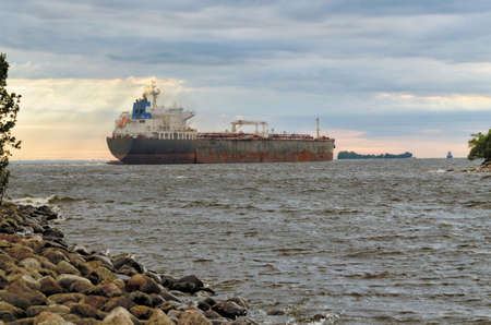 The big ship goes to sea.This is a commercial cargo ship.の写真素材