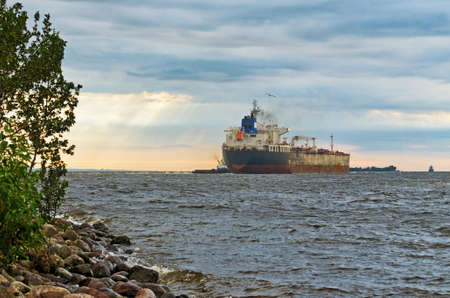 The big ship goes to sea.This is a commercial cargo ship.の写真素材