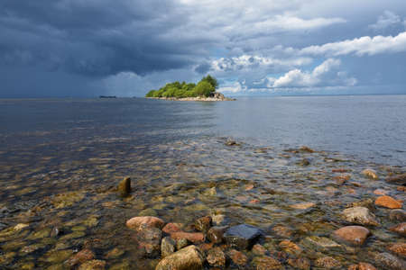 Beautiful seascape and water waves.In the sky, over the sea, blue clouds.の写真素材