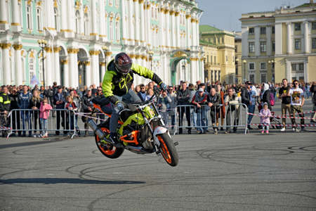 Saint Petersburg, Russia. September 26.2020.A biker festival is taking place. a biker demonstrates difficult and dangerous stunts on his motorcycle.This underlines his mastery of technique.のeditorial素材