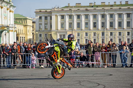 Saint Petersburg, Russia. September 26.2020.A biker festival is taking place. a biker demonstrates difficult and dangerous stunts on his motorcycle.This underlines his mastery of technique.のeditorial素材